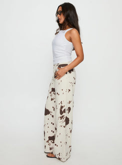 side view of model wearing Princess Polly Big Dreamer Low Rise Straight Leg Jeans Cow Print Low Rise Jeans 