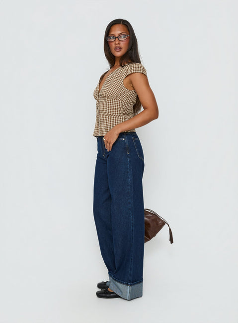 side view of model wearing Princess Polly Darla Low Rise Straight Leg Cuff Jean Dark Blue Wash Low Rise Jeans 