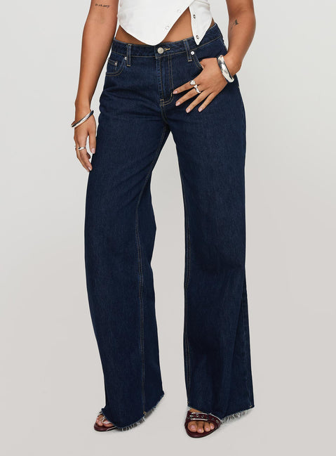 side view of model wearing Princess Polly Darla Low Rise Straight Jean Dark Wash Petite Low Rise Jeans 