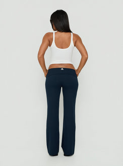Presenting the Layover Straight Leg Pants Navy Stripe womens-regular-pants with mid-rise waist back view of model wearing Princess Polly