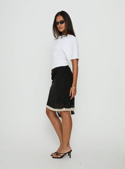Shop the Shoreline Midi Skirt Noir in womens-skirts with fitted a-line silhouette showcasing midi length and lace hem details side view of model wearing Princess Polly