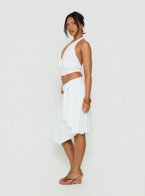 Featuring the Soft Focus Tie Waist Midi Skirt White womens-skirts in midi length with solid print and wrap detail side view of model wearing