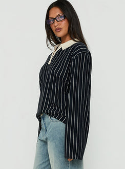Showcasing the Boarders V Neck Polo Jumper Navy Stripe womens-jumpers in short length with oversized fit side view of model wearing Princess Polly