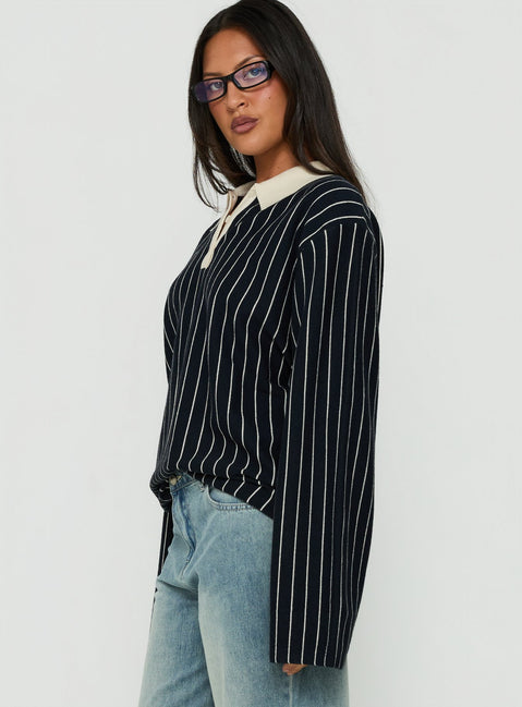Showcasing the Boarders V Neck Polo Jumper Navy Stripe womens-jumpers in short length with oversized fit side view of model wearing Princess Polly