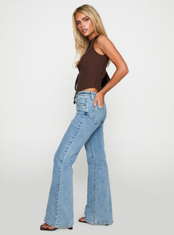 side view of model wearing Princess Polly Magic Mirror Mid Rise Bootleg Jeans Ice Wash Tall Mid Rise Jeans 