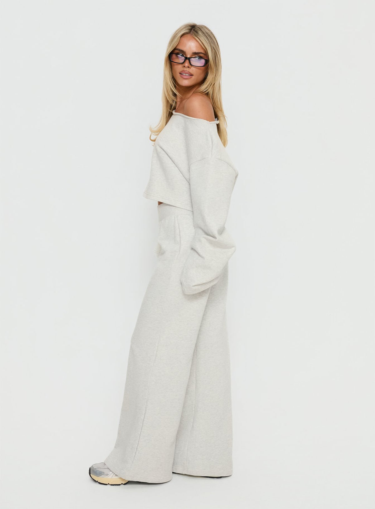 side view of model wearing Princess Polly Peaks Flared Track Pants Snow Marle Mid Rise Pants Pants 