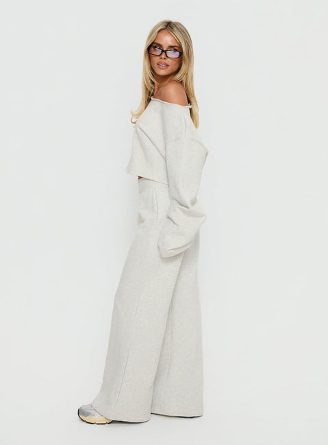 side view of model wearing Princess Polly Peaks Flared Track Pants Snow Marle Mid Rise Pants Pants 