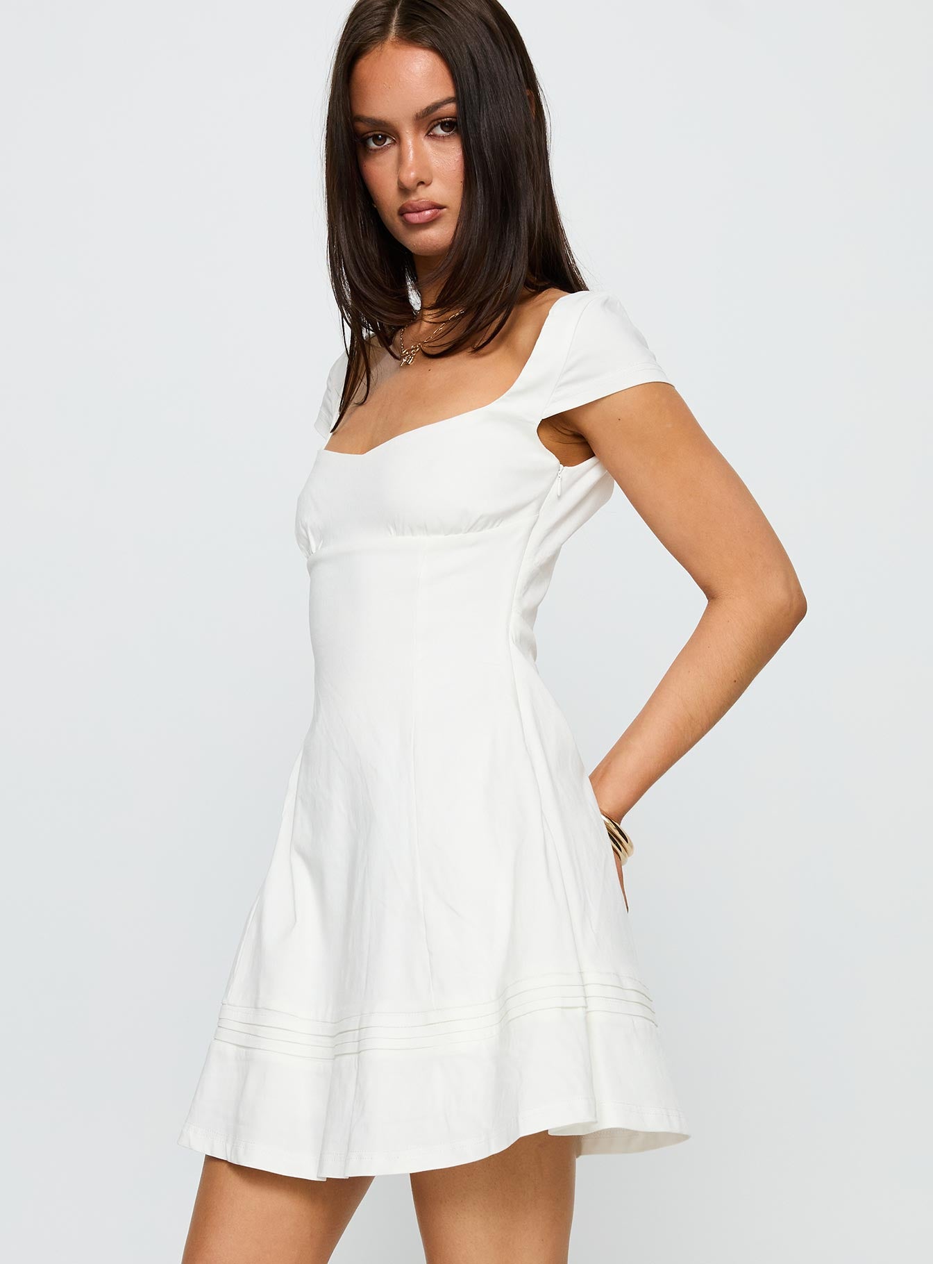 side view of model wearing Princess Polly Infinite Wonders Mini Dress White Sweetheart Neckline 