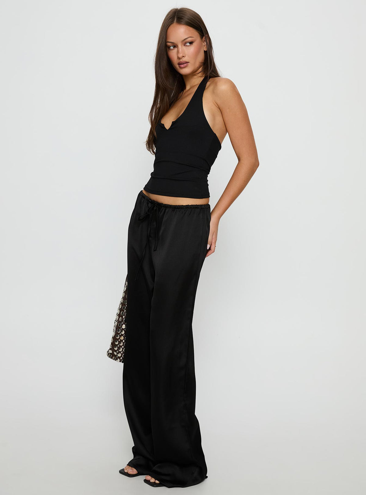 side view of model wearing Princess Polly Soulstar Satin Pants Black High Rise Pants 