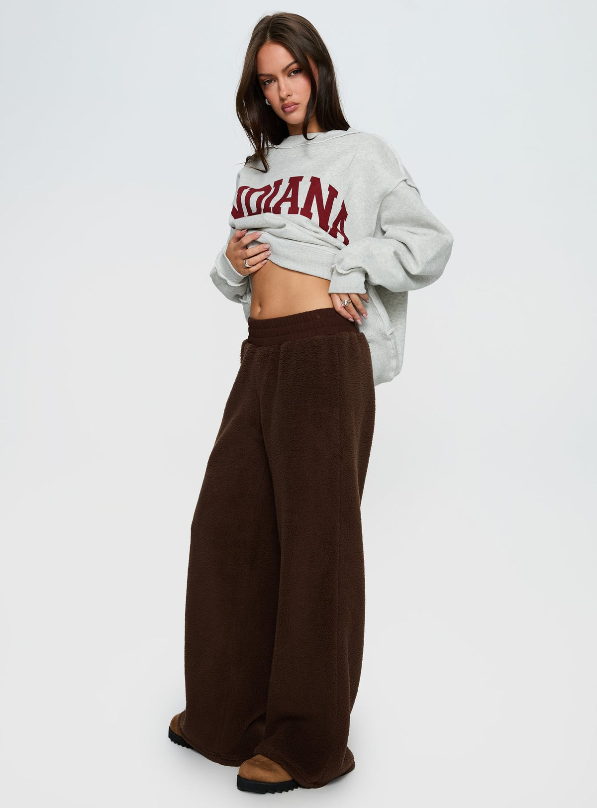 side view of model wearing Princess Polly Siberia Fleece Track Pant Chocolate Brown High Rise Pants 