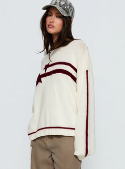 side view of model wearing Princess Polly Star Track Graphic Jumper Cream / Red Longline Jumpers 