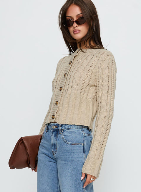 side view of model wearing Princess Polly Donielle Cable Knit Cardigan Beige cropped Jumpers 