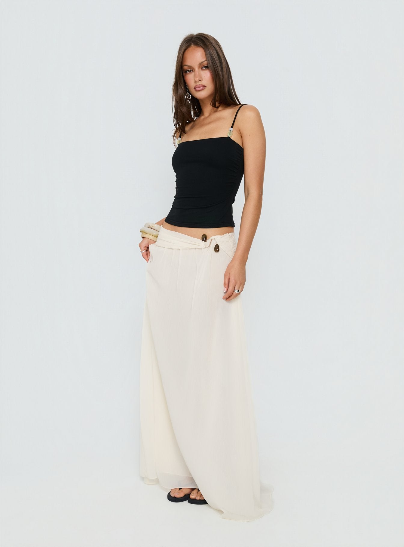   side view of model wearing Princess Polly Kaledia Chiffon Draped Maxi Skirt Cream Maxi Skirts 