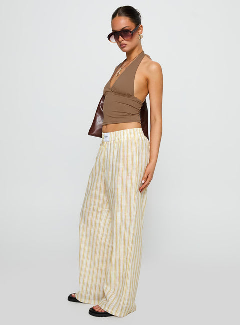 side view of model wearing Princess Polly Beach House Pants Yellow Stripe High Rise Pants Pants 
