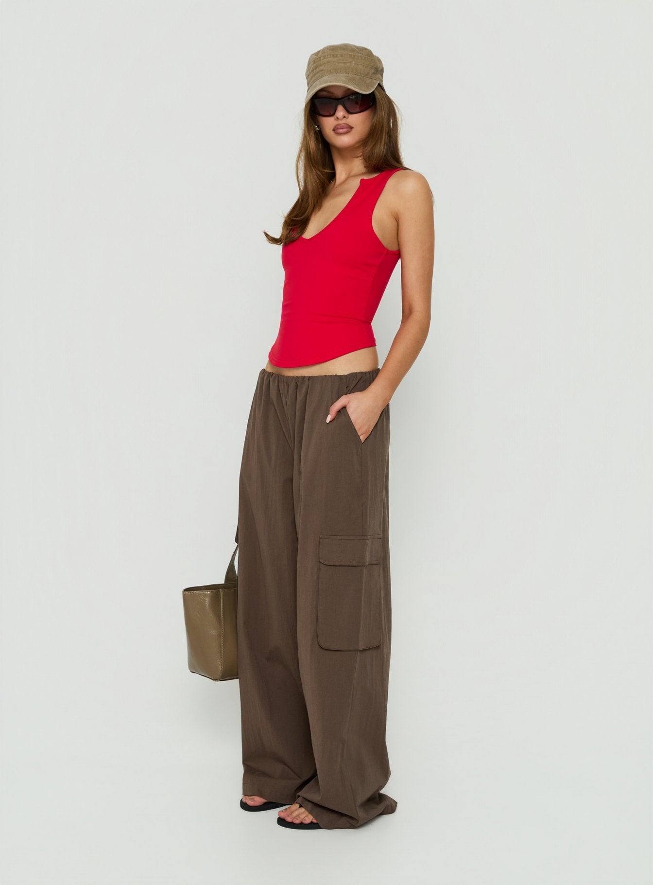 Designed with the Lunea Concealed Waistband Cargo Pants Brown in womens-regular-pants featuring high-rise side view of model wearing Princess Polly