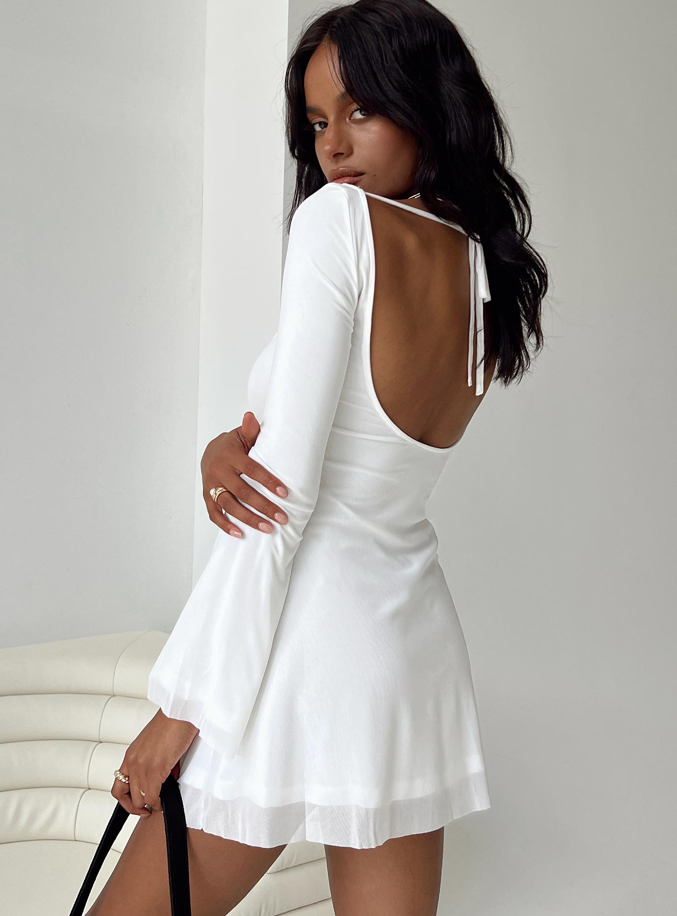back view of model wearing Princess Polly Lukea Long Sleeve Mini Dress White Petite Boat Neck 