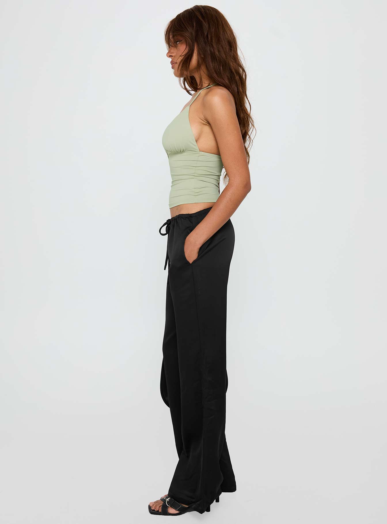 side view of model wearing Princess Polly Vanille Tie Waist Satin Pants Black Low Rise Pants Pants 