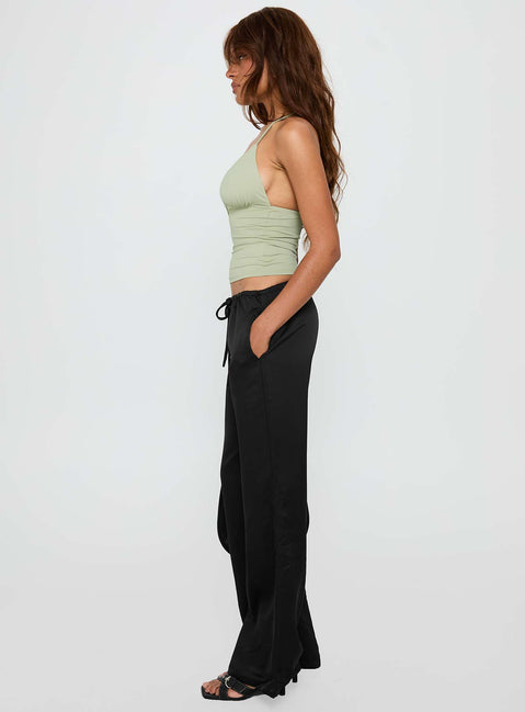 side view of model wearing Princess Polly Vanille Tie Waist Satin Pants Black Low Rise Pants Pants 