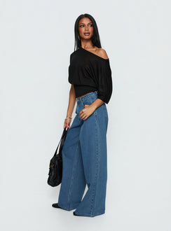 back view of model wearing Princess Polly Naylor Mid Rise Wide Leg Jeans Mid Blue Wash Mid Rise Jeans 