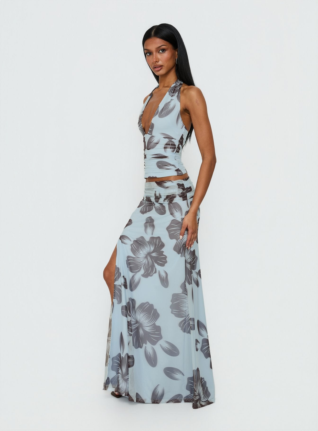   side view of model wearing Princess Polly Roselin Mesh Maxi Skirt Blue Floral 