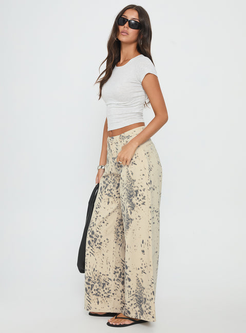side view of model wearing Princess Polly Naylor Mid Rise Wide Leg Jeans Animal Spot Mid Rise Jeans 