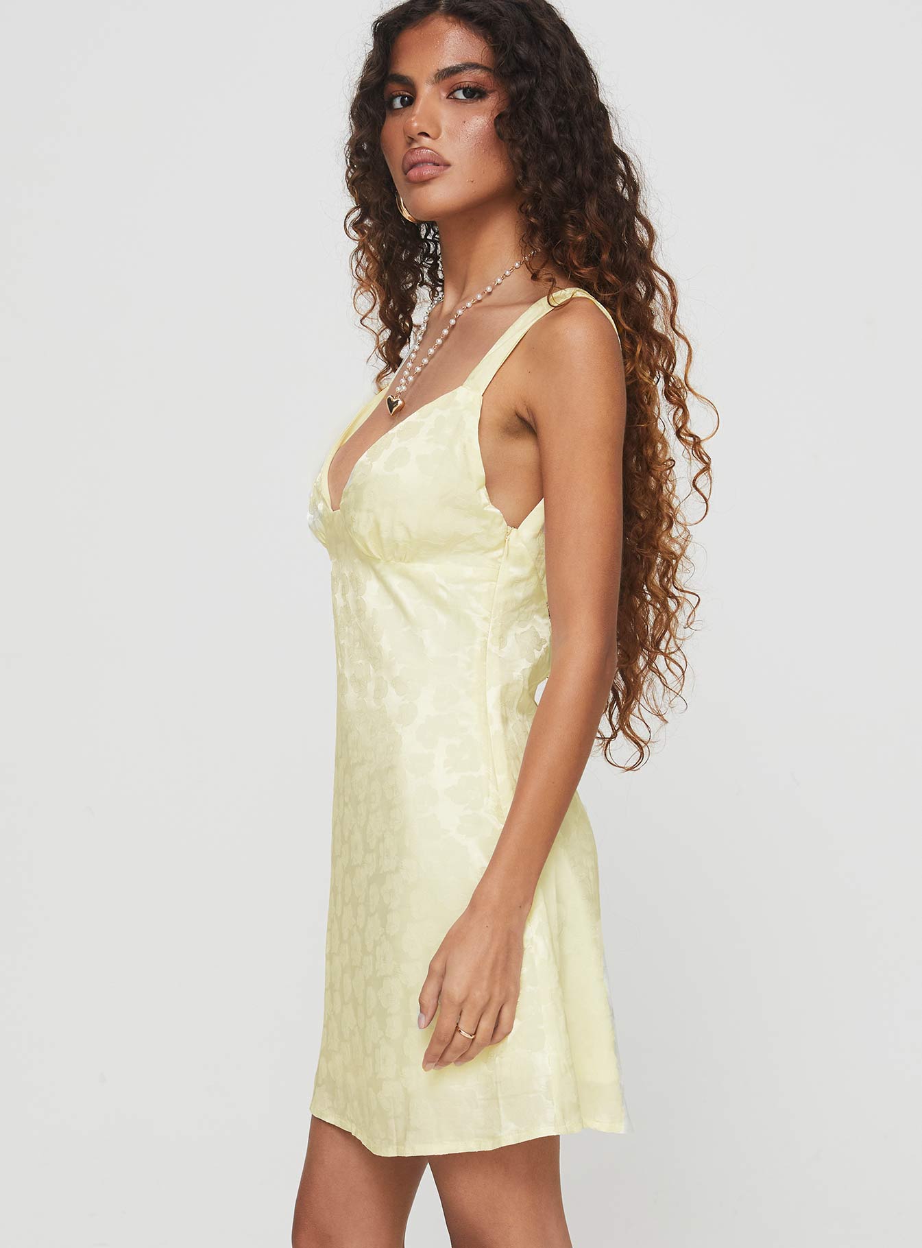 side view of model wearing Princess Polly Life In Peace Mini Dress Cream Plunger 