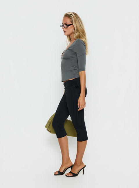 side view of model wearing Princess Polly Bailor Channel Waistband Capri Pants Black Mid Rise Pants 