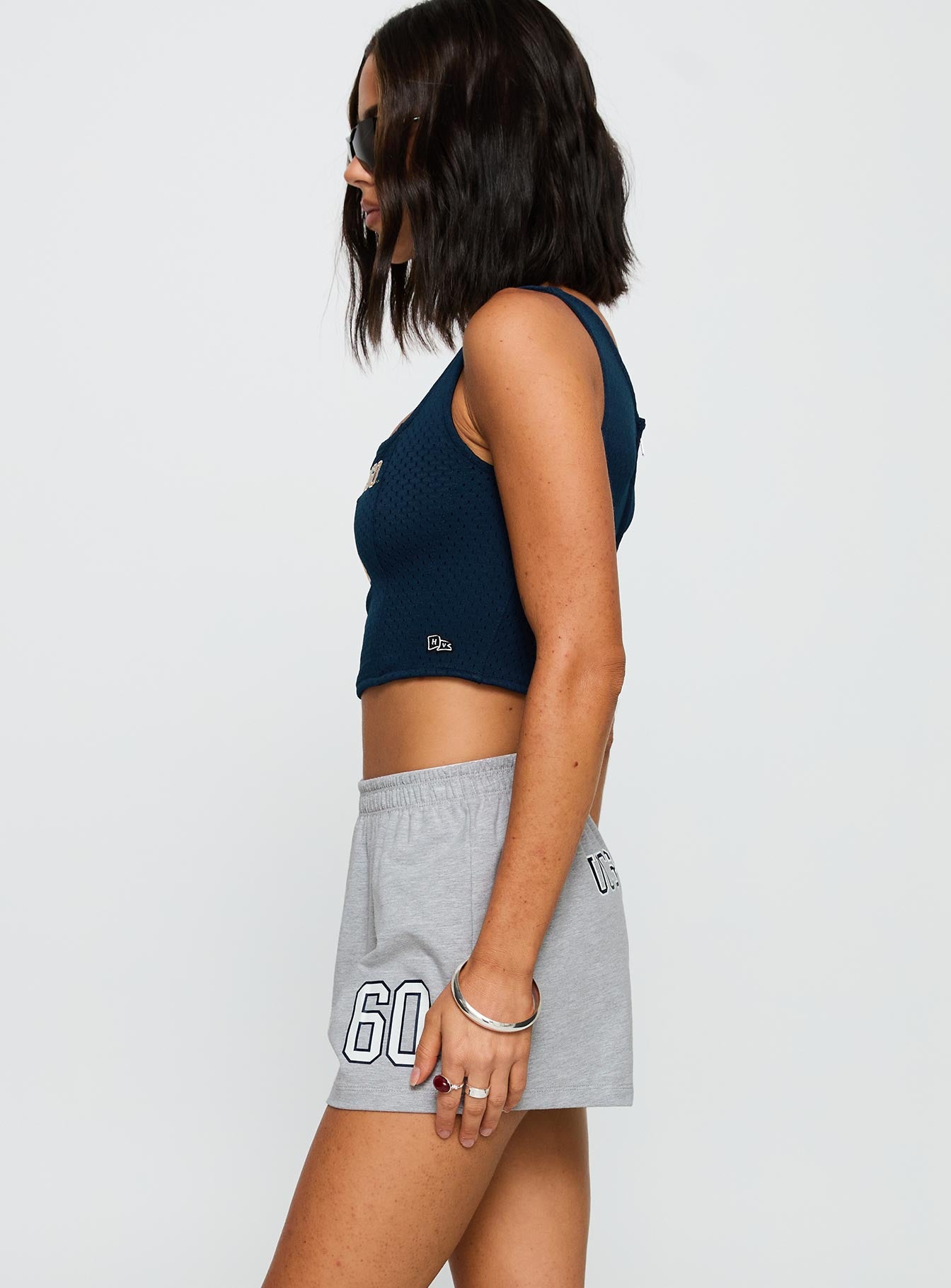 side view of model wearing Princess Polly UC San Diego Soffee Short Heather Grey High Waisted Shorts 