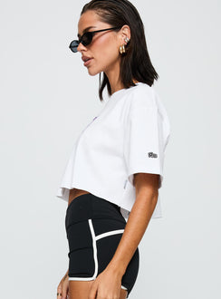 side view of model wearing Princess Polly Nyu Track Tee White Half Sleeves Crew Neck 