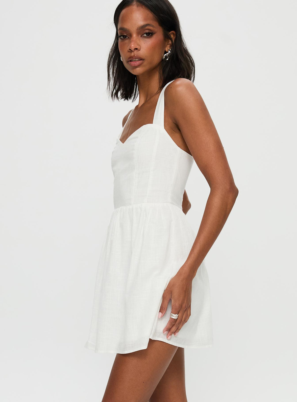 side view of model wearing Princess Polly Zolena Halter Mini Dress White Sweetheart Neckline 
