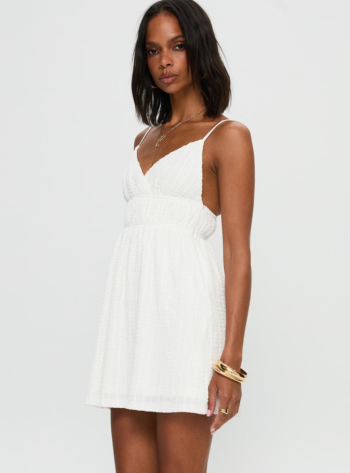 side view of model wearing Princess Polly All Too Well Mini Dress White V-Neck 
