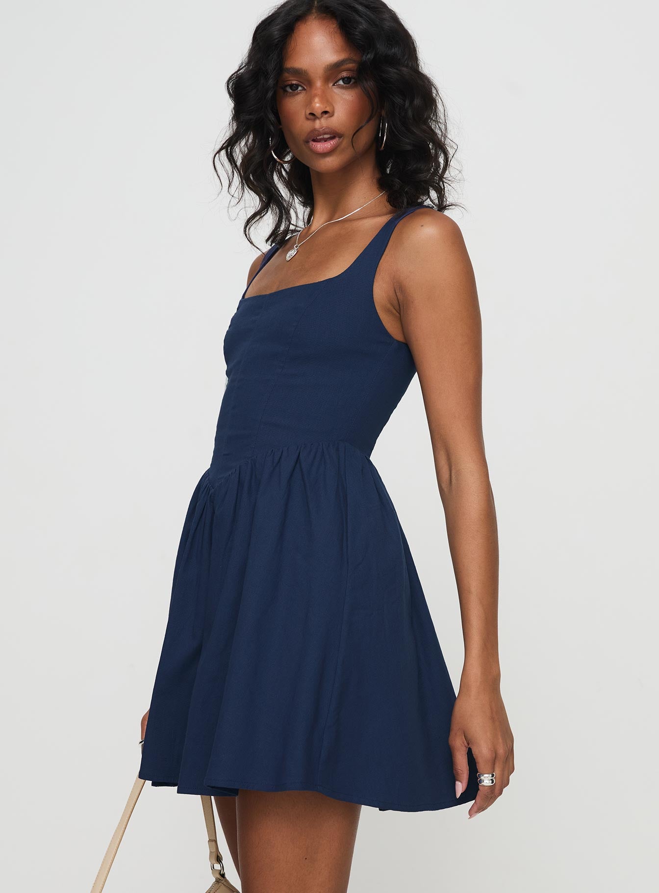 side view of model wearing Princess Polly Martie Mini Dress Navy Square Neck 