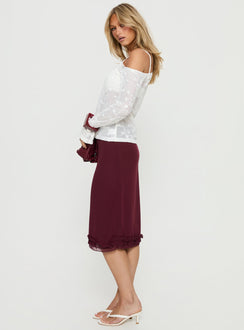   side view of model wearing Princess Polly Rosette Frill Midi Skirt Currant 