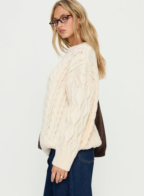 Displaying the Rorey Cable Knit Crew Neck Sweater White womens-jumpers with oversized fit in long length detail view of model wearing Princess Polly