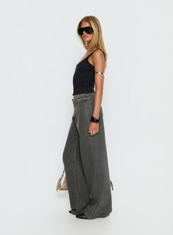 side view of model wearing Princess Polly Paltrow Mid Rise Wide Leg Cargo Jeans Washed Grey Mid Rise Jeans 