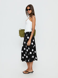   side view of model wearing Princess Polly Picture It Midi Skirt Black Polka Dot Midi Skirts 