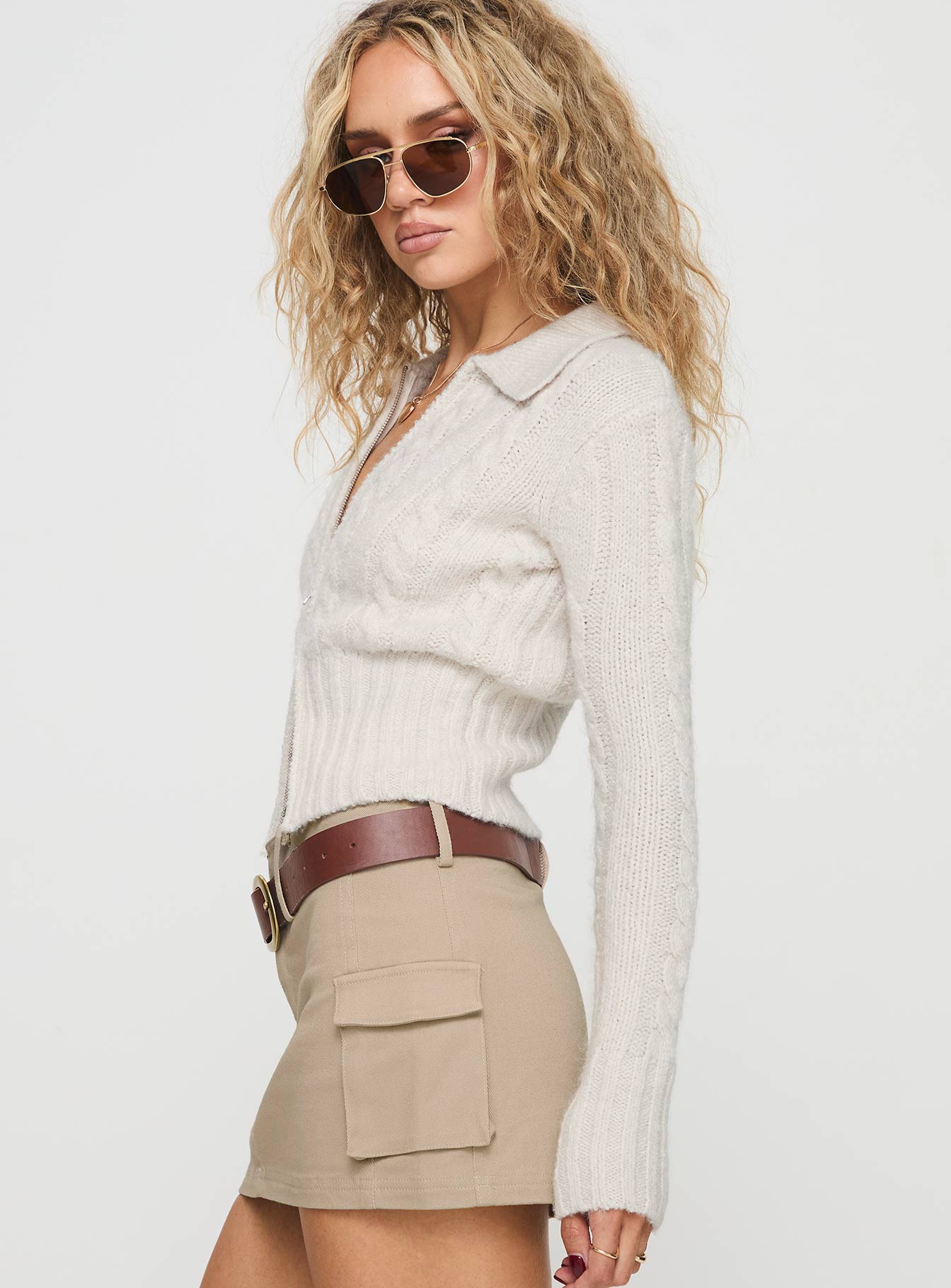 side view of model wearing Princess Polly Jeller Zip Front Knit Sweater Beige Cropped Jumpers Jumpers 