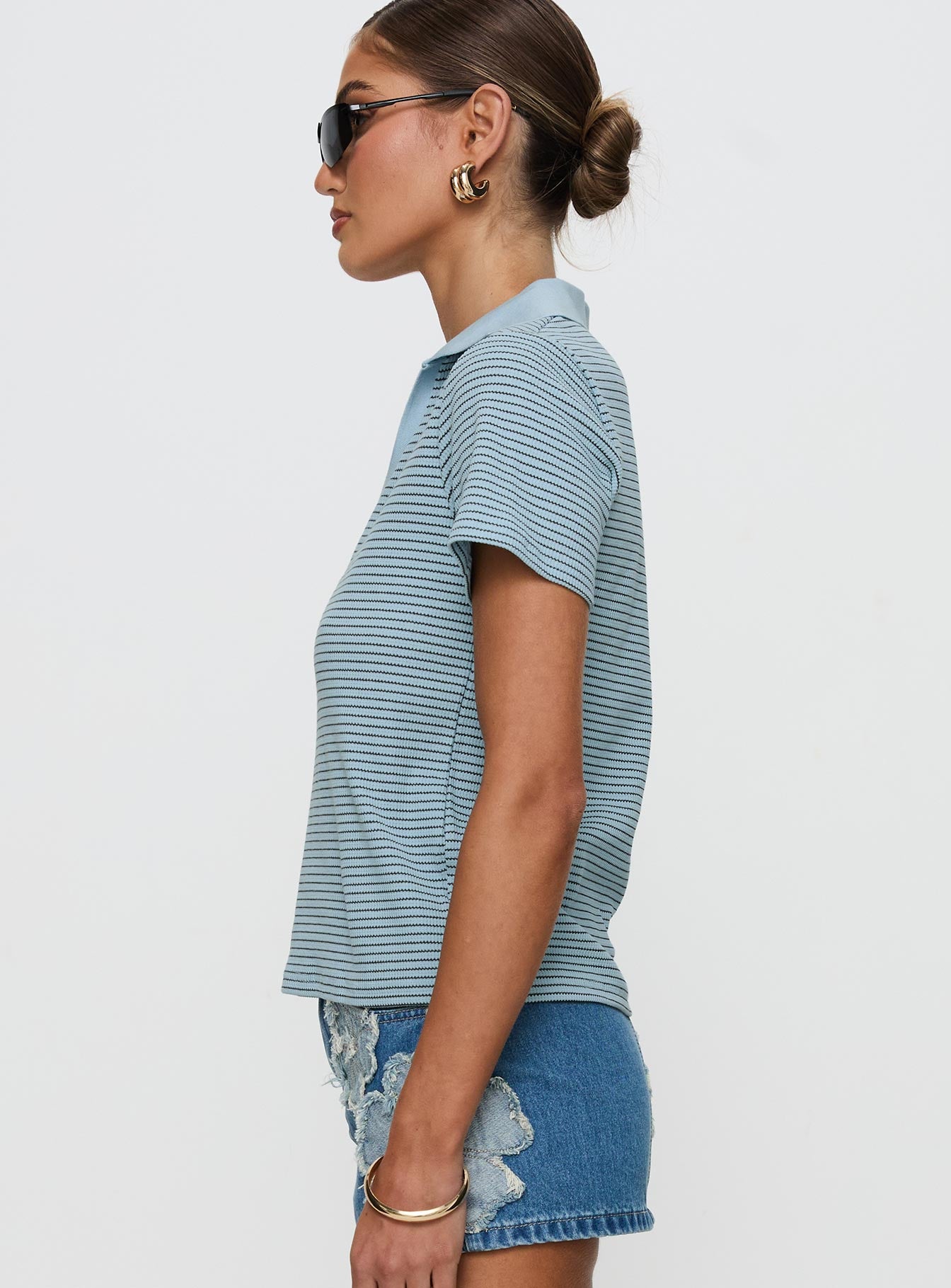 side view of model wearing Princess Polly Ralphy Collared Top Blue Stripe Short Sleeves V-Neck 