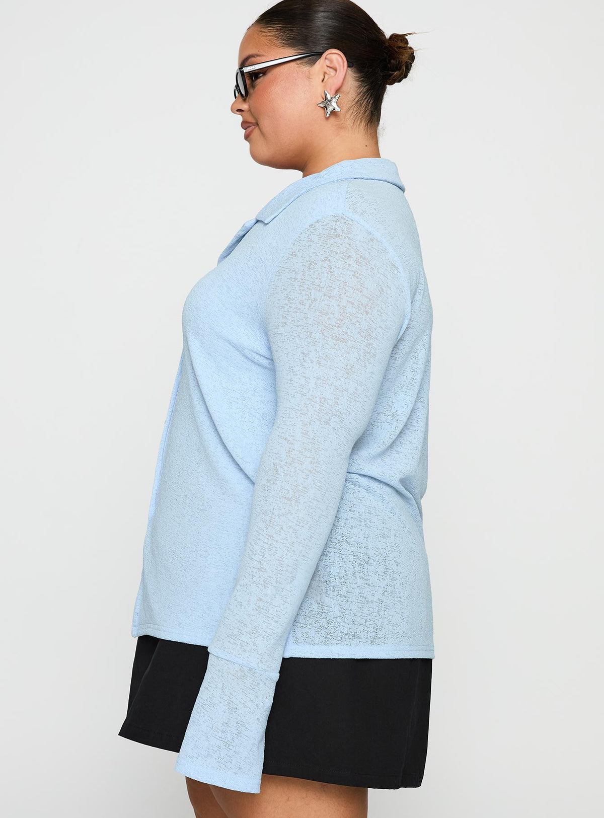 side view of model wearing Princess Polly Finnean Long Sleeve Top Pale Blue Curve Full Sleeves V-Neck 