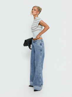 side view of model wearing Princess Polly Ramos Diamante Low Rise Wide Leg Jeans Washed Mid Blue Low Rise Jeans 