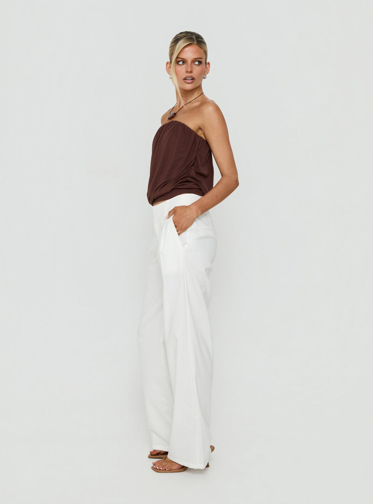 Discover the Two Lovers Linen Low Rise Pants White in womens regular pants, featuring wide-leg cut and low-rise waist, side view of model wearing