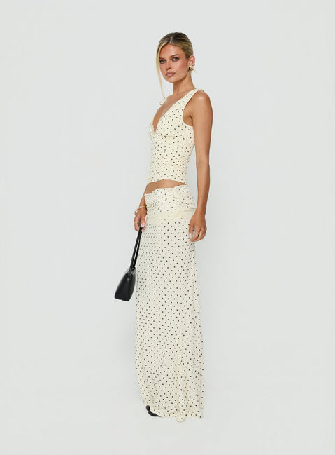 Showcasing the Zespri Jersey Maxi Skirt Cream Polka Dot womens-skirts featuring maxi length side view of model wearing Princess Polly