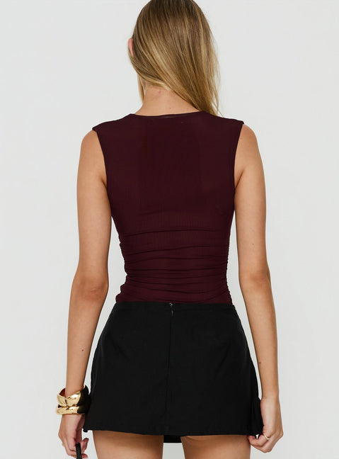 Crafted with ruched detailing, the Samaria Plunge Neck Bodysuit Burgundy in womens-bodysuit featuring sleeveless design back view of model wearing