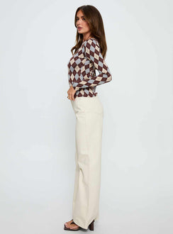 side view of model wearing Princess Polly Maple Mid Rise Flare Jeans Ecru High Rise Jeans Jeans 