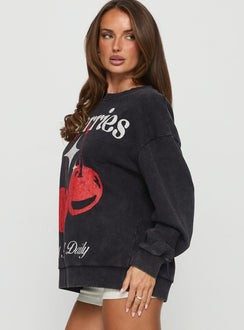 side view of model wearing Princess Polly Hand Picked Graphic Jumper Black 