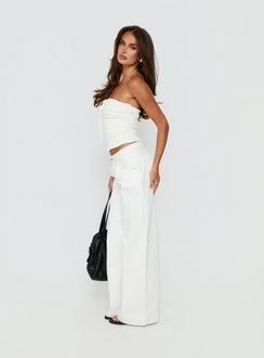 side view of model wearing Princess Polly Supercut Low Rise Baggy Pleat Jeans Cream Mid Rise Jeans Jeans 