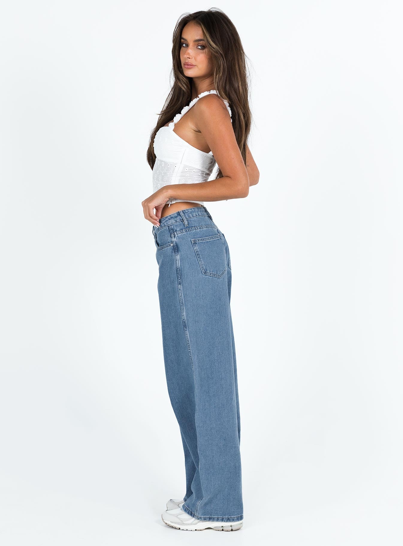 side view of model wearing Princess Polly Maryanne Mid-rise Relaxed Denim Jeans Mid Wash Denim Tall Mid Rise 