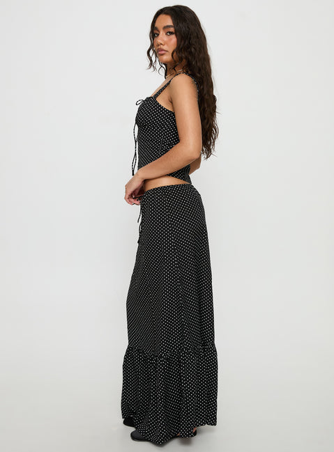  side view of model wearing Princess Polly Modern Girl Maxi Skirt Black / Polka Dot Skirts 