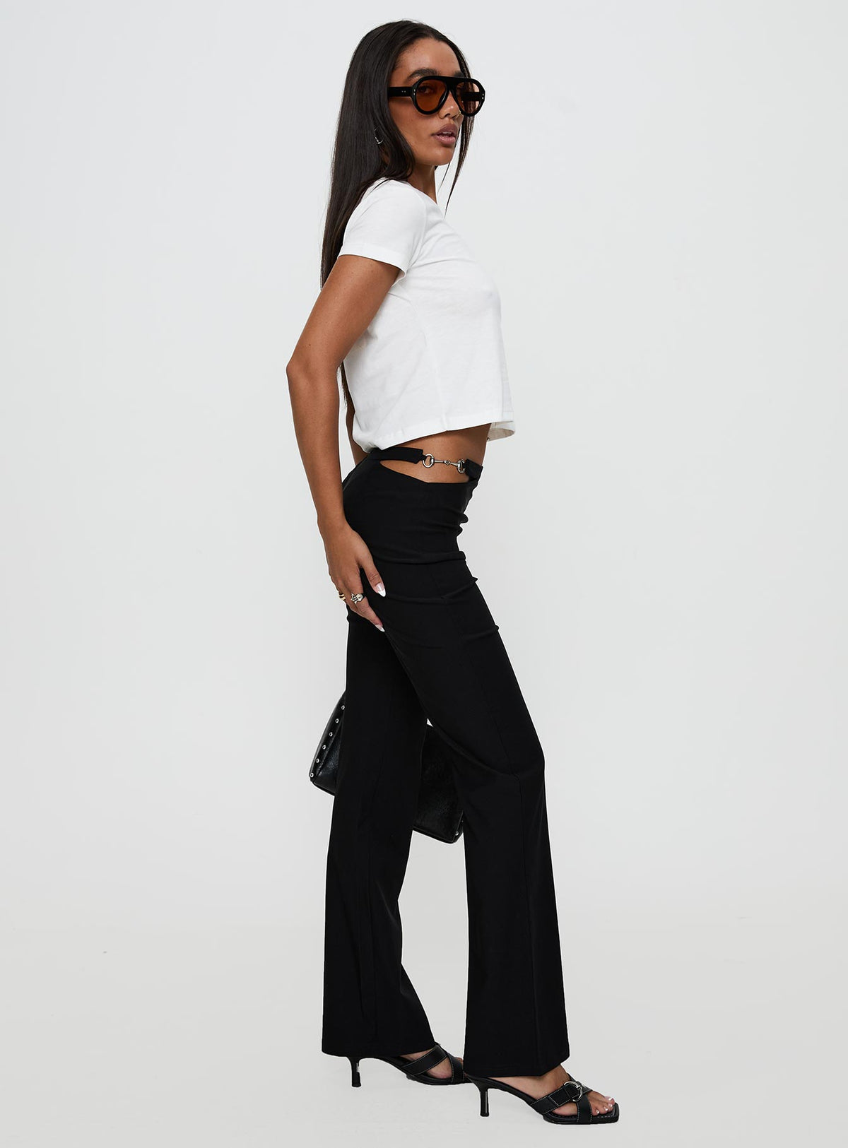side view of model wearing Princess Polly Eyes On You Flare Pants Black High Waisted Pants 