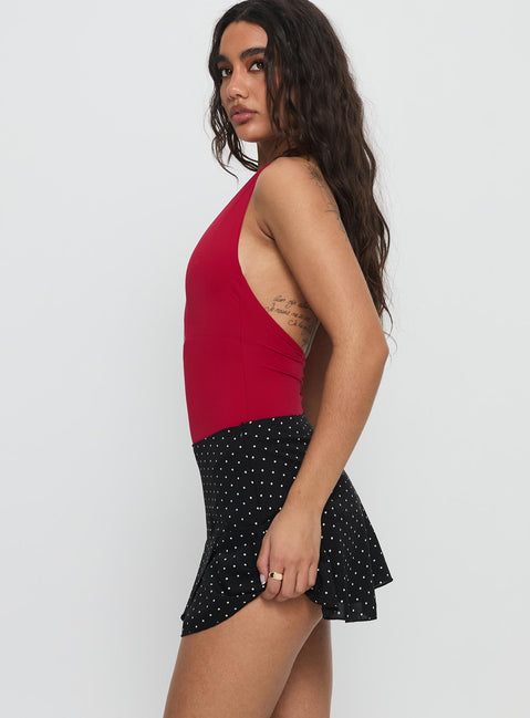   side view of model wearing Princess Polly Sonsie Mini Skirt Black / White Polka Mini Skirts Skirts 